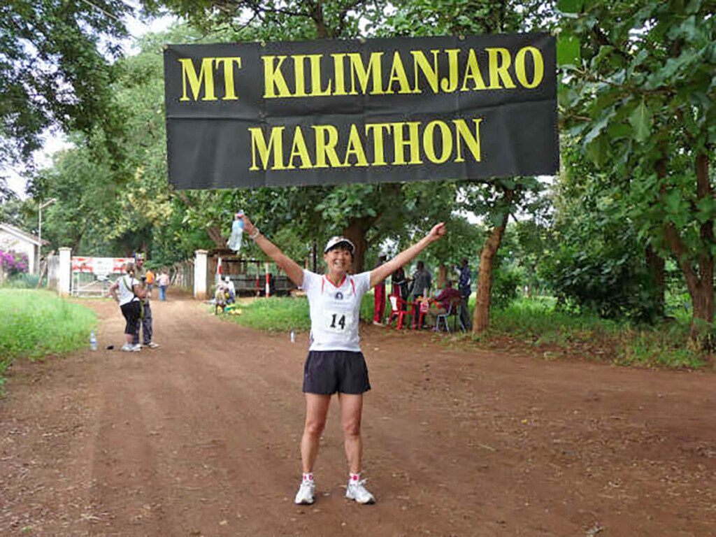 Mt. Kilimanjaro Marathon Runner Under Banner